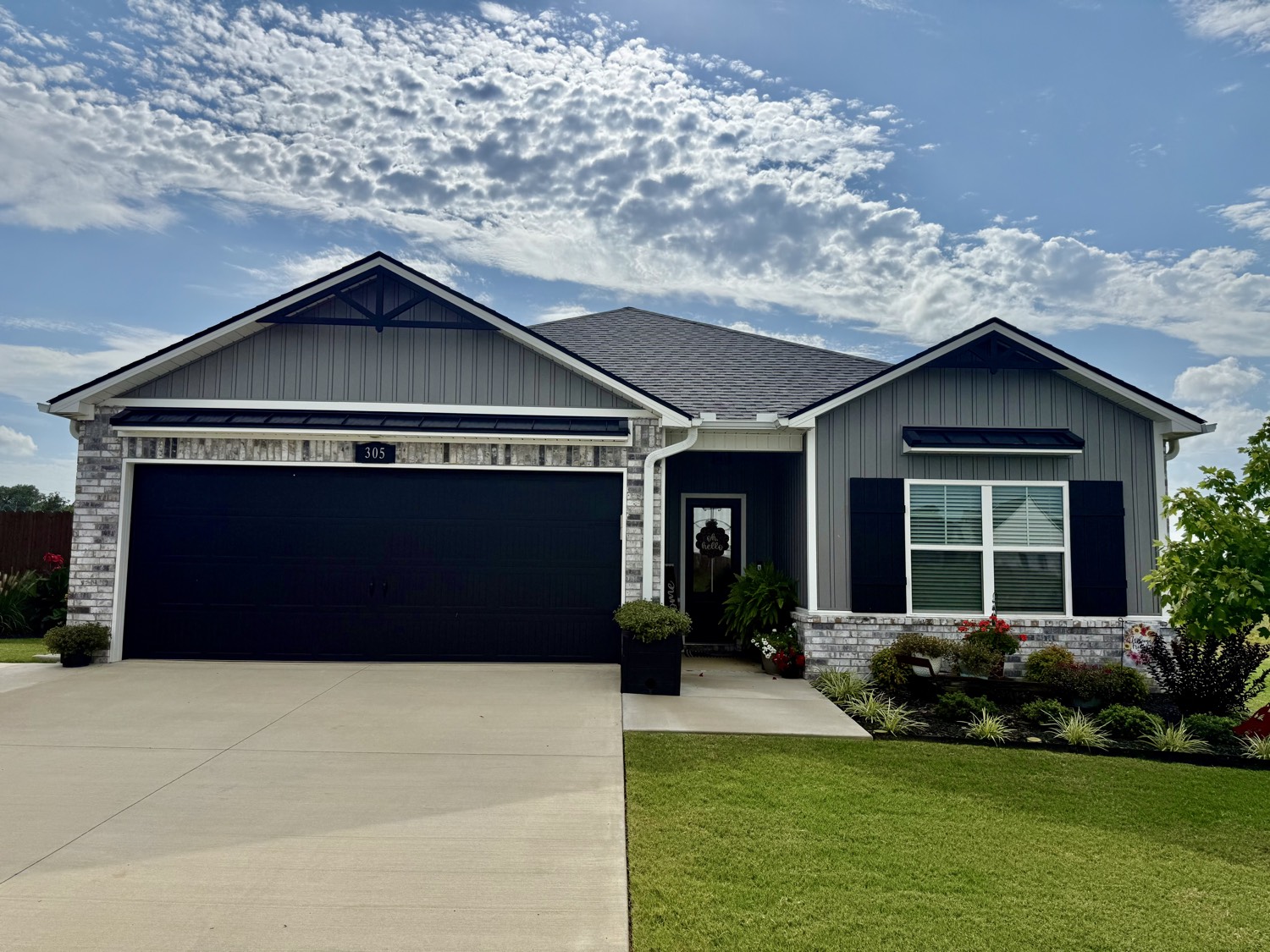 Finished custom home at 305 Twisted Oak Way in East Village